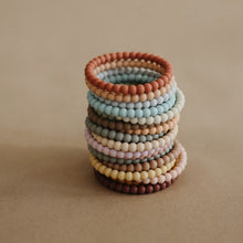 Load image into Gallery viewer, mushie silicone pearl teether bracelets - clary sage, tuscany + desert sand
